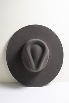 Timeless and eternally cool, our Stevie wide brim ivory wool hat features a sturdy, structured brim and tone-on-tone ribbon trim around the brim edge and crown base. Book a virtual session with one of our stylists to customize your hat band and make it uniquely you. Details: 100-percent Australian wool Crown 4" Brim (firm) 3 and 7/8" Hidden adjustable band for fit flexibility Size guide Return policy Wide Brimmed Hats, Ribbon Trim, Hat Band, Brim Hat, Wool Hat, Wide Brimmed, 100 Percent, Charcoal Grey, Size Guide