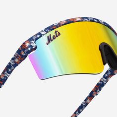 You've got it made in these shades. Kick back, relax, and support your squad in style with the New York Mets Floral Large Frame Sunglasses. Features Shield sunglasses with gradient lenses, the perfect look for every sunny day Floral, team-colored design on rim and temples so you can rep the team in style Printed wordmark team name display on upper corners of lens, in case there were any doubts where your allegiances lie Comfortable nose pad to keep you comfy on those extended afternoons outdoors Multicolor Shield Sunglasses For Outdoor Activities With Uva Protection, Multicolor Shield Sunglasses With Uva Protection For Outdoor Activities, Multicolor Shield Sunglasses With Uva Protection For Outdoor, Sporty Sunglasses With Uv Protection For Sports Events, Casual Multicolor Sunglasses For Sports, Multicolor Sunglasses With Uv Protection For Outdoor Activities, Trendy Sports Sunglasses With Gradient Lenses, Multicolor Sports Sunglasses For Summer, Multicolor Tinted Sunglasses For Outdoor Activities