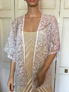 This is a beautiful hand made lace kimono ideal as a cover-up for weddings or special occasions. The lace has an interesting leaf design. It has a satin edging. It can be made in any size from 8 to 24 (UK sizes). It is made in the UK. It is normally sent out to you within 5 days, but I am very happy to make your order a priority if you need it urgently. Just let me know the date needed by. Postage is free in the UK! International postage is £9. I am happy to exchange items or refund your payment Lace Kimono, White Leaf, Kimono Jacket, Elbow Length Sleeve, Leaf Pattern, Leaf Design, Beautiful Hand, Three Quarter, Mother Of The Bride