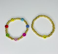 New to bay creations these cute little smiley beaded bracelets.  Bracelets are made out of 4 mm glass and acrylic beads strong on elastic cord. Adjustable Smiley Face Round Bead Jewelry, Cheerful Adjustable Jewelry For Gifts, Smiley Face Beaded Bracelets As Gift, Smiley Face Round Beads Bracelet For Gift, Smiley Face Round Beads Bracelet As Gift, Playful Beaded Bracelets As Gift, Playful Gold Jewelry With Smiley Face, Playful Gold Smiley Face Jewelry, Adjustable Smiley Face Round Bead Bracelets