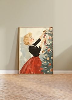 there is a painting on the wall with a woman holding a christmas tree in front of it