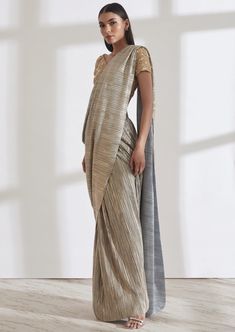 Our signature metallic 2.0 sari comes with a built in petticoat. Lightweight, fuss free and easy to wear, it’s the perfect piece to carry to destination weddings. Fusion Style Silk Pre-draped Saree With Traditional Drape, Fusion Style Silk Pre-draped Saree, Fusion Style Wedding Saree With Unstitched Blouse, Festive Fusion Silk Pre-draped Saree, Fusion Style Silk Pre-draped Saree For Wedding, Fusion Pre-draped Saree For Wedding And Diwali, Fusion Style Pre-draped Saree With Zari Work, Fusion Style Pre-draped Saree With Dupatta For Wedding, Fusion Style Pre-draped Wedding Saree