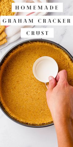 someone is adding graham cracker to the crust in a pie pan with text overlay that reads homemade graham cracker crust