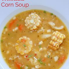 a white bowl filled with soup on top of a table