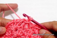 someone is crocheting the stitchs together