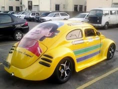 a yellow car is parked in a parking lot