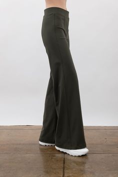 This high-rise pant is tailored with vertical seams to create the illusion of longer legs. It provides comfort with stretch fabric technology while also creating a flat waistline. It has a stylish wide-leg silhouette and pintuck detailing and features a pull-on design for ease of wear. Wide leg pant with elastic waistband Cut from our comfortable and flattering Tech Stretch fabric 94% Nylon, 6% Elastane Gentle wash with like colors and air dry, or dry clean Made in Japan Front Rise 10 1/4”, Inse Chic Stretch Wide Leg Yoga Pants, Stretch Wide-leg Yoga Pants For Workwear, Stretch Wide Leg Yoga Pants For Work, Full Length Dress Pants With Elastic Waistband, Chic Full-length Bottoms With Seam Detailing, Chic Full Length Bottoms With Seam Detailing, Elegant Stretch Wide Leg Yoga Pants, Modern Wide-leg Elastane Pants, Versatile Wide Leg Pants With Minimal Stretch