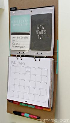 a desk calendar is attached to a bulletin board