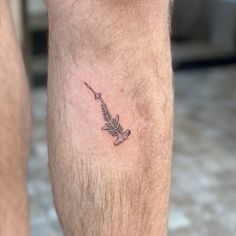 a man with a tattoo on his leg