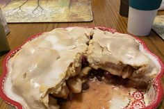 a partially eaten pie sitting on top of a wooden table