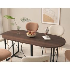 a dining table with chairs around it and a bowl of fruit on the table top