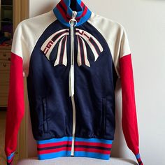 Gucci Bow Track Jacket. Size Xs. Nwt. Red/White/Navy/Royal Blue With Cream Zipper. From The Guccify Yourself Collection Gucci Long Sleeve Track Jacket For Fall, Gucci Casual Track Jacket For Winter, Gucci Casual Winter Track Jacket, Sporty Gucci Outerwear For Fall, Casual Gucci Winter Track Jacket, Casual Long Sleeve Gucci Track Jacket, Gucci Long Sleeve Track Jacket For Winter, Fitted White Gucci Outerwear, Gucci Multicolor Outerwear For Fall