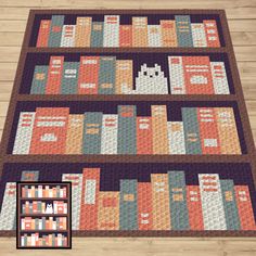 a quilted bookcase with books on it and an image of a cat in the middle