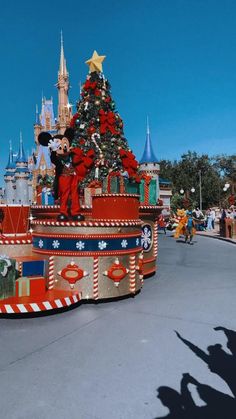 the mickey mouse float is decorated for christmas