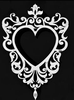 a black and white photo with a heart cut out in the shape of a frame