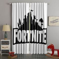 a curtain with the word fortnite on it in front of a rocking horse