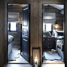 an open door leading to a bedroom with a bed in the corner and a candle on the floor