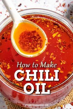 how to make chili oil in a glass jar with a spoon on the side and text overlay