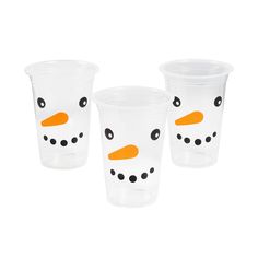 three plastic cups with faces painted on the side and one has an orange nose, two are