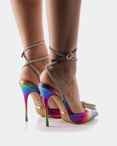 Detail(s):  Pointy Toe 4.5" Heel Rhinestone Bow Detail Adjustable Ankle Strap Material(s):  Leather Upper Padded Insole   Handmade in Brazil Color(s):  Multicoloured Multicolor Leather Ankle Strap Heels, Spring Rainbow Open Toe Heels, Rainbow Pointed Toe Heels, Multicolor Ankle-high Heels, Rainbow Open Toe Platform Heels, Brazil Colors, Rainbow Metal, Rhinestone Bow, Ankle Straps