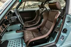 the interior of a car with brown leather seats