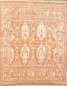 an orange and white rug with many different designs on the bottom, one is very large