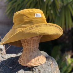 "A yellow wide brim corduroy sun hat for beach days and sunny day fun.  This sun hat for women has a nice wide brim to protect your whole face and even your neck and chest.  Easy to bring along in your bag, folds up easy.   This hat is made from a mustard yellow cotton corduroy fabric.  Inside liner is white cotton.  I used interfacing inside the brim to keep it's shape. Brim measures 4.5\" Crown depth is 3.5\". Contact me for custom fit option. SIZES AVAILABLE S - measures 22.5\" (fits heads wi Cute Yellow Bucket Hat, Cheap Fun Yellow Bucket Hat, Large Brimmed Hats, Cheap Yellow Festival Hat, Yellow Bucket Hat For Outdoor Summer Activities, Yellow Outdoor Hat With Uv Protection, Yellow Sun Hat With Uv Protection For Outdoor, Yellow Beach Bucket Hat, Yellow Summer Outdoor Bucket Hat