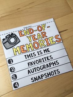 a sign that says end of year memories, with an image of a camera on it