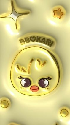 a close up of a cartoon character on a white surface with gold circles and stars