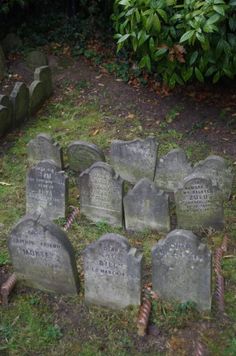 many headstones are placed in the grass