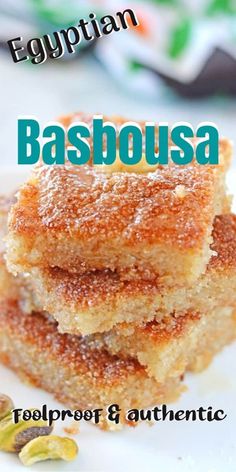 two pieces of cake sitting on top of a white plate with the words basabusa above it