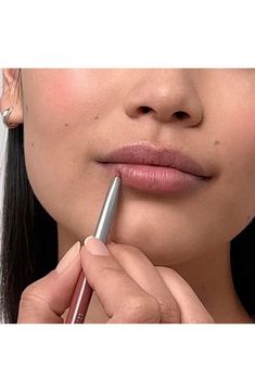 What it is: A liner that helps keep lipstick in place while preventing feathering and bleeding—plus it doesn't require a sharpener.What it does: Line and define or smooth all over lips before lipstick application for extended wear. A non-drying formula helps keep lipstick in place all day long. How to use: Follow dot-dot-dash method to ensure ease and accuracy of application–draw two dots on upper lip's bow, a dash across bottom of lower lip, then connect all three. To extend lip colour wear, fi Lipstick Application, Lip Liner Pencil, Dash And Dot, Two Dots, Cheek Stain, Draw Two, Lower Lip, Dot Dot, Upper Lip