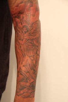 a man with a tattoo on his arm