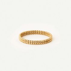 This Double Ball Beaded Eternity Ring, forged from 14K solid gold, epitomizes minimalist elegance. Ideal for stacking, its understated design suits any style and makes it a perfect gift for her. This ring's dainty bead detailing offers a unique twist on traditional jewelry, ensuring it stands out in the world of real gold accessories. 14k solid gold handcrafted pieces 100% ethical sourced jewelry Material: 14k Solid Gold Width: 2.6 mm / 0.10 in Stackable Yellow Gold Dome Ring Fine Jewelry, Beaded Gold Stacking Ring, Simple 14k Gold-filled Yellow Stackable Rings, Beaded Stacking Rings, Gold Accessories, Traditional Jewelry, Perfect Gift For Her, Stacking Ring, Stacking Rings