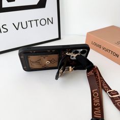 the louis vuitton camera strap is brown