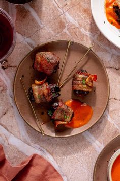 Chorizo-Stuffed Bacon Wrapped Dates Bacon Dates, The Defined Dish, Wrapped Dates, Defined Dish, Roasted Pepper Sauce, Roasted Red Pepper Sauce, Bacon Wrapped Dates, Red Pepper Sauce, Chorizo Sausage