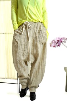 "Harem Pants Linen, Women Linen Pants, Beige Pants ☆ Woman summer pants ☆ NEW collection! Beige 100% pants of high quality eco linen. The pants are very comfortable. These pants are both sports and everyday. You can go to work with them, you can also wear them in the free days. Loose fitting. Model wearring size M Color : Natural The style was originally designed and professionally constructed by me. Each item of my shop is specially packaged with a lot of concern! Handmade in a pet-free and smo Vintage Non-stretch Bottoms With Pockets, Vintage Wide Leg Cargo Pants For Summer, Bohemian Style Baggy Pants With Pockets, Vintage Pants With Elastic Waistband And Relaxed Fit, Vintage Relaxed Fit Pants With Elastic Waistband, Bohemian Parachute Pants With Pockets, Bohemian Bottoms With Side Pockets For Spring, Spring Bohemian Bottoms With Side Pockets, Oversized Beige Pants With Pockets