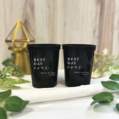 two black cups with the words best day ever on them