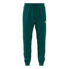 adidas originals Sst Tp Logo Sweat Pants Green Sweatpants With Side Stripes For Streetwear, Green Bottoms With Side Stripes For Streetwear, Adidas Casual Joggers With Side Stripes, Green Side Stripe Pants For Streetwear, Green Pants With Side Stripes For Streetwear, Green Streetwear Pants With Side Stripes, Casual Green Bottoms With Three Stripes, Adidas Three Stripes Joggers For Streetwear, Adidas Sweatpants With Side Stripes For Sports