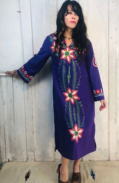 Vintage Indian Embroidered Kaftan Heaven!Gorgeous Purple With Vibrant Colors Of Red, White And Green In A Beautiful Hand Embroidered PatternFantastic Bohemian PieceFolk ArtSoft Vintage CottonCirca 1970sSize~ XS/SBust~19" seam to seam total 32-38"Waist~ 18”seam to seam total 24-38”Hips~ 18”total 32-38”Length~ 43” Bohemian Embroidered Maxi Dress For Navratri, Fitted Bohemian Embroidered Dress For Navratri, Bohemian Resham Embroidered Dress For Festive Occasions, Traditional Purple Kaftan For Festive Occasions, Long Sleeve Embroidered Dress For Navratri, Blue Bohemian Embroidered Dress For Festive Season, Bohemian V-neck Embroidered Dress For Festive Occasions, Bohemian Blue Chikankari Embroidered Dress, Blue Bohemian Chikankari Embroidered Dress