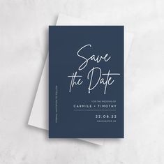 save the date card on top of a piece of paper