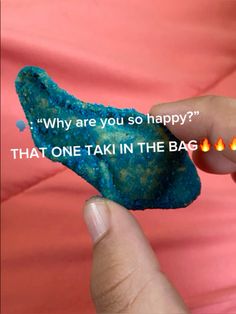 a person holding a piece of rock with the words, why are you so happy? that one tak in the bag