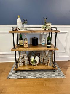 a bar cart with liquor bottles on it