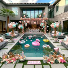 an outdoor pool decorated with balloons and flamingos