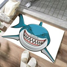 a bathroom rug with a cartoon shark on it's side and teeth in the middle