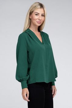 Elevate your wardrobe with our Woven Airflow V-Neck Long Sleeve Top, a versatile piece that effortlessly combines style and comfort. This top features a flattering V-neckline that adds a touch of sophistication to your look. The ruched shoulder detail adds a hint of texture and elevates the overall design. Made from breathable woven fabric, it ensures comfort throughout the day while keeping you looking chic.PRODUCT SPECIFICATIONS*100% Polyester*Machine wash cold, gentle cycle, tumble dry low.*M V-neck Workwear Top In Solid Color, Solid Color V-neck Workwear Top, V-neck Solid Color Top For Work, V-neck Solid Color Workwear Top, Versatile Long Sleeve V-neck Top For Work, Versatile Solid Color V-neck Top, Chic Long Sleeve V-neck Top, Solid V-neck Blouse For Layering, Chic Solid Top With Notched Neckline