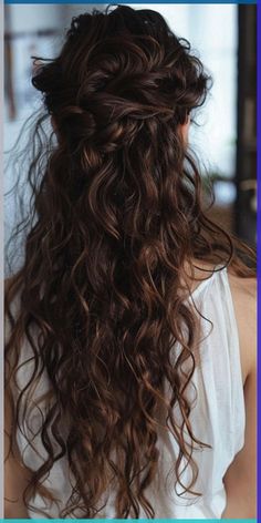 the back of a woman's head with long curly hair