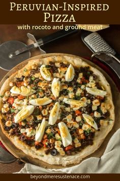 a pizza sitting on top of a pan covered in toppings next to a slice of cheese