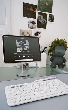 a computer keyboard sitting on top of a desk