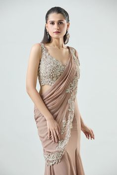 Peach pre-draped saree in a mermaid silhouette. Comes with detachable drape featuring embellished sequin, bead and pearl embellished floral paisley motifs. Paired with sequin, bead and pearl embellished padded blouse. - Aza Fashions Elegant V-neck Pre-draped Saree For Festive Occasions, Sleeveless Evening Pre-draped Saree With Dupatta, Elegant V-neck Georgette Blouse, Elegant Georgette V-neck Blouse, Fitted V-neck Pre-draped Saree, Elegant Saree With V-neck Unstitched Blouse, Elegant V-neck Pre-draped Festive Saree, Fitted Elegant Saree For Gala, Elegant Sleeveless Pre-draped Saree For Festive Occasions